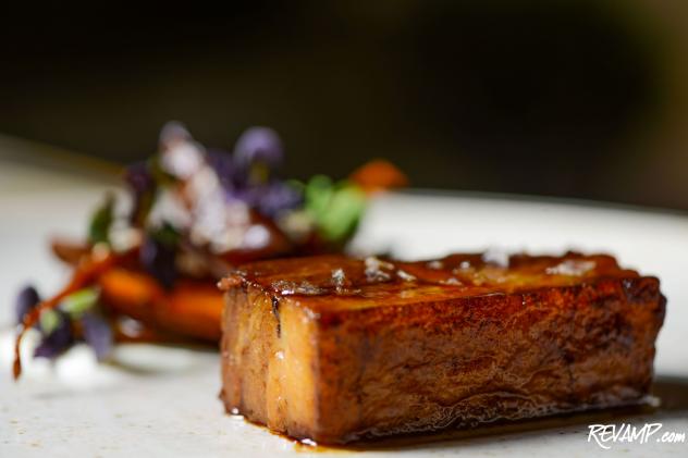 Pork Belly with baby maroon carrots, plums, cardamom-scented cr&egrave;me fraiche, vanilla, and sesame seeds.